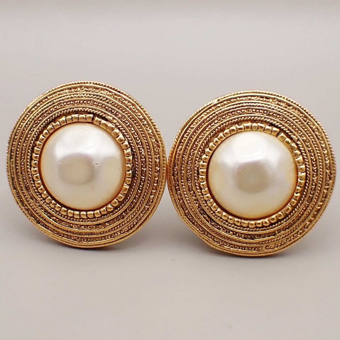 Round Clip-On Earrings by Chanel in Vintage Gold Tone (1 of 1)