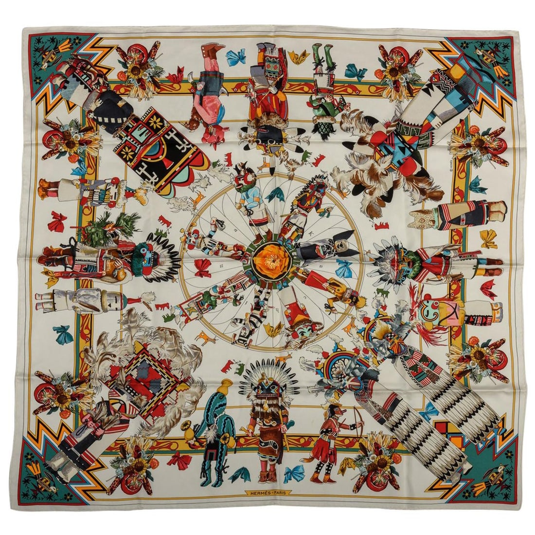 Hermes Kachinas Silk Scarf by Kermit Oliver 35 in France: Hermes Kachinas Silk Scarf by Kermit Oliver 35 in France Experience the elegance of the Hermes Kachinas White Silk Scarf, a stunning piece designed by renowned American artist Kermit Oliver. This luxu