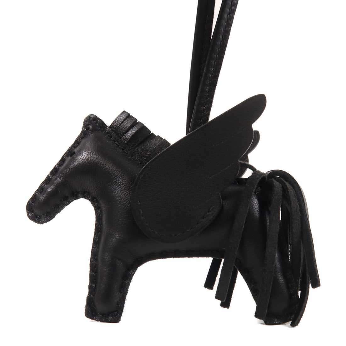 HERMES Rodeo Pegase PM Black Lambskin Charm: HERMES Rodeo Pegase PM Black Lambskin Charm Introducing the HERMES Rodeo Pegase PM Charm, a luxurious accessory crafted from premium lambskin (sheep leather) in a sleek black color. This charm is perf