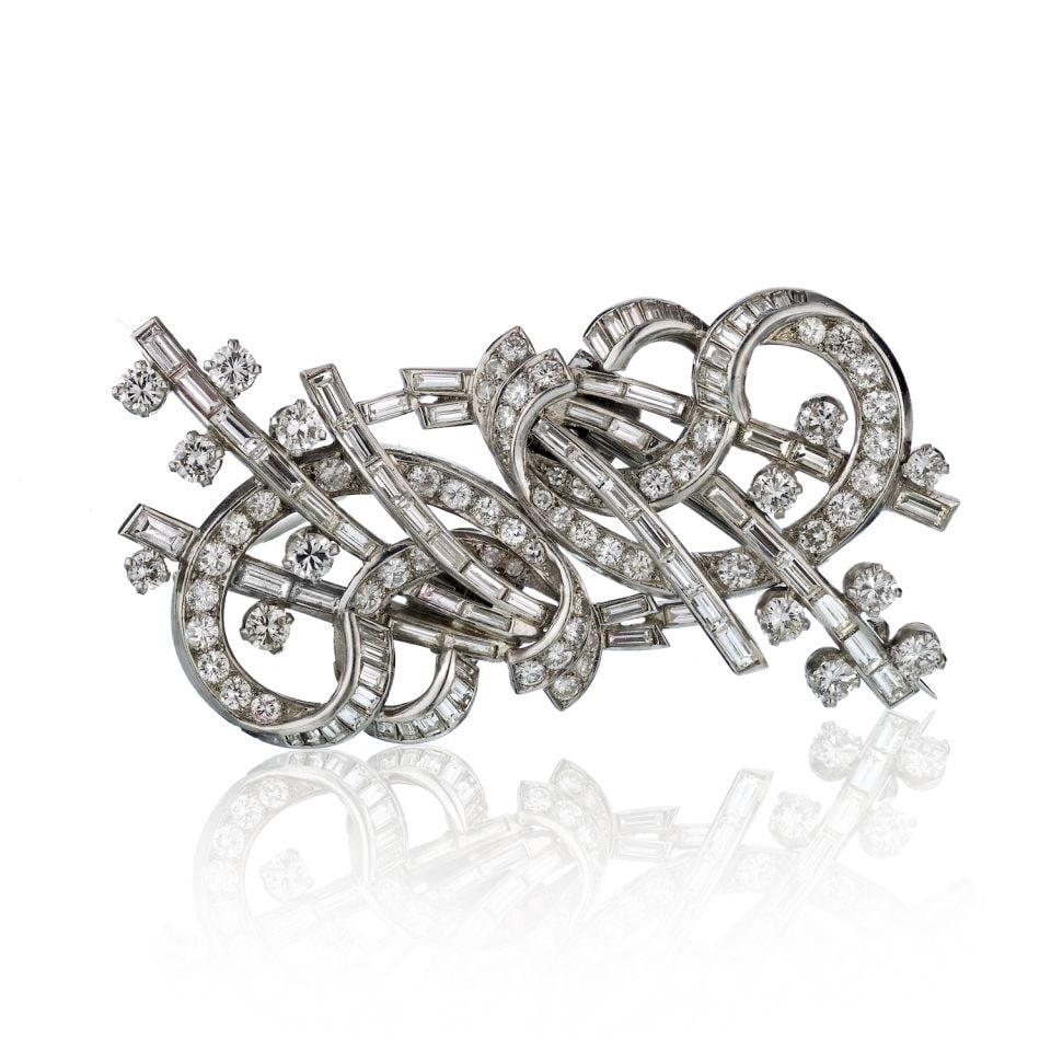 Art Deco Platinum Double Clip Brooch 8.50ct Diamonds: Art Deco Platinum Double Clip Brooch 8.50ct Diamonds This exquisite Art Deco Platinum Double Clip Brooch showcases approximately 8.50 carats of stunning diamonds, featuring a combination of round cuts