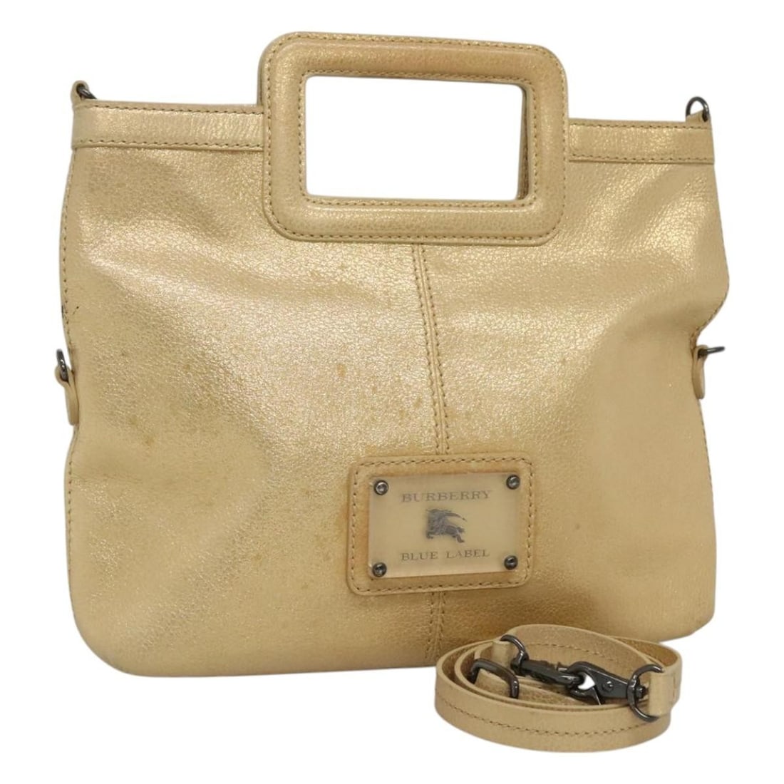 Blue Label tote by Burberry with gold accents: Blue Label tote by Burberry with gold accents This Burberry Blue Label tote bag features a gold finish and is designed for female use. The bag is in good condition and has a length of 5 cm. It is a st