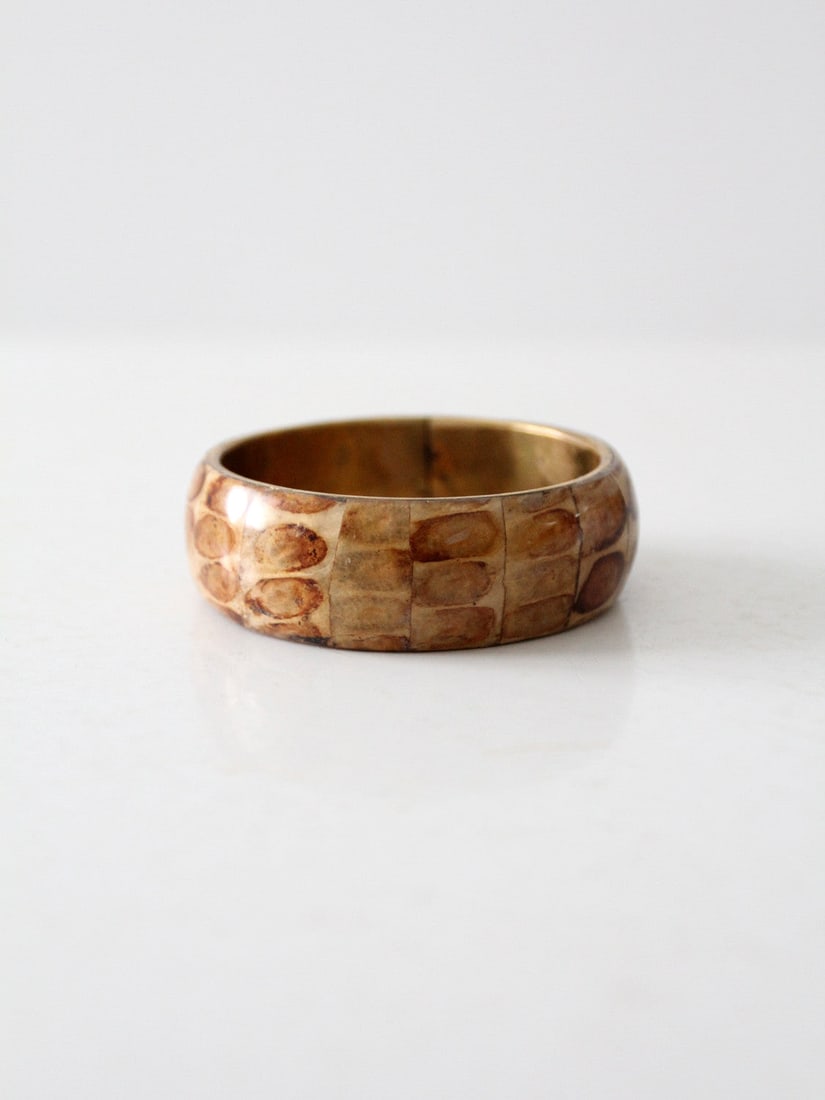 1970s Vintage Chunky Slip On Bracelet with Reptile Print: 1970s Vintage Chunky Slip On Bracelet with Reptile Print This vintage slip-on bracelet features an eye-catching reptile print that elegantly wraps around a chunky design from the 1970s. The bracelet b