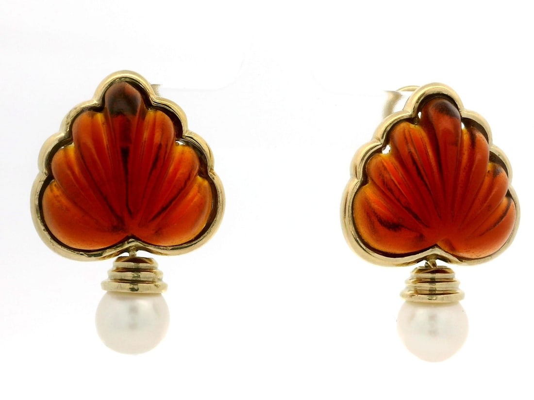 Vintage Omega 18k Gold Carved Orange Stone Pearl Dangle Earrings: Vintage Omega 18k Gold Carved Orange Stone Pearl Dangle Earrings These stunning vintage dangle drop earrings showcase a unique design crafted from 18k yellow gold. Each earring features beautifully sc