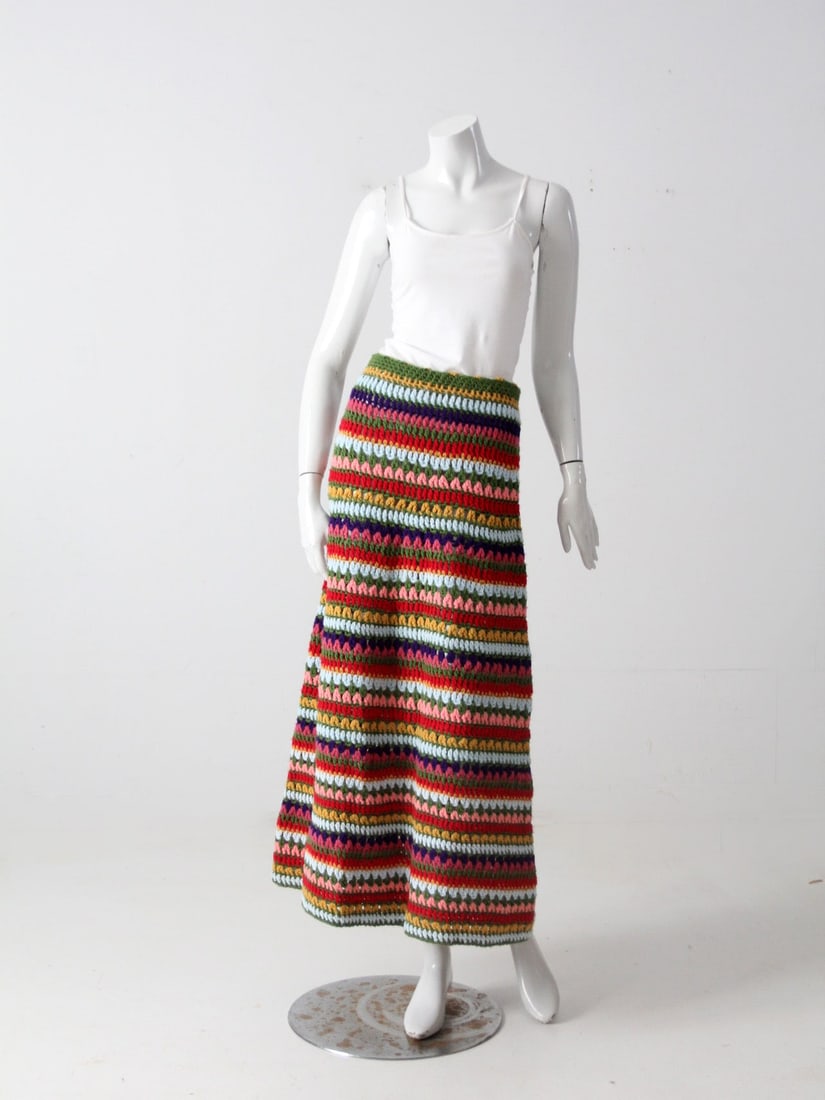 Boho Vintage Hand-Knit Maxi Skirt Striped Rainbow Pattern: Boho Vintage Hand-Knit Maxi Skirt Striped Rainbow Pattern Embrace a bohemian flair with this vintage hand-knit maxi skirt. Featuring a unique afghan blanket style knit, it showcases a vibrant striped