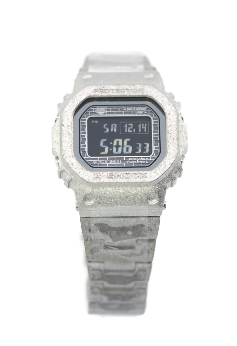 Casio G-Shock GMWB5000PS-1 Stainless Steel Watch with Box: Casio G-Shock GMWB5000PS-1 Stainless Steel Watch with Box Introducing the Casio G-Shock Stainless Steel Watch GMWB5000PS-1, a perfect blend of durability and style. This wristwatch features a robust s