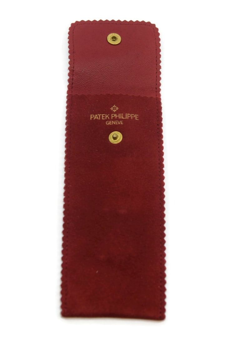 Patek Philippe Red Fabric Travel Watch Pouch 6x2 Inches Authentic: Patek Philippe Red Fabric Travel Watch Pouch 6x2 Inches Authentic This stylish travel pouch from Patek Philippe is designed to securely hold your watch while on the go. Crafted from high-quality fabri