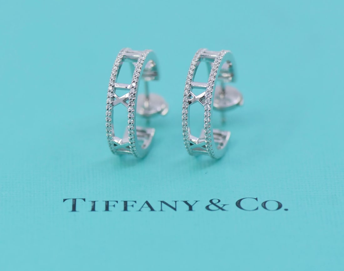 Tiffany & Co Atlas Diamond Hoop Earrings in 18K White Gold: Tiffany & Co Atlas Diamond Hoop Earrings in 18K White Gold These exquisite Tiffany & Co. Atlas Diamond Earrings feature a classic hoop style crafted from 18K white gold, showcasing the luxury and eleg
