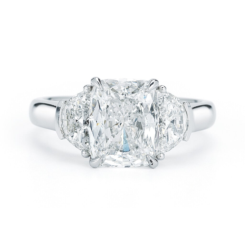Rachel Koen Three Stone Cushion Cut Diamond Engagement Ring 4.12cts Platinum: Rachel Koen Three Stone Cushion Cut Diamond Engagement Ring 4.12cts Platinum This exquisite three-stone engagement ring features a stunning cushion cut diamond at its center, flanked by two additional