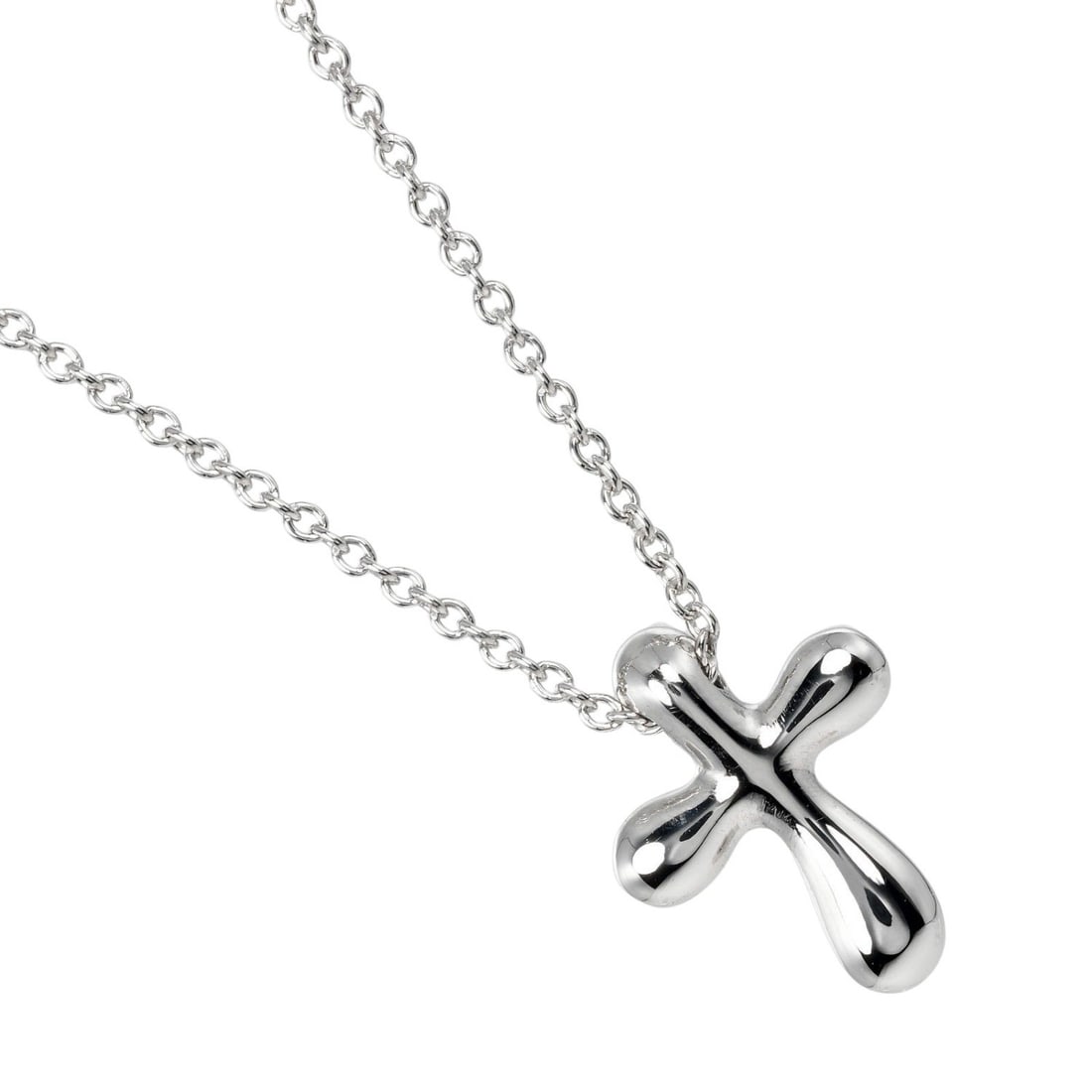 Silver Cross Necklace by Tiffany & Co. Pendant Design: Silver Cross Necklace by Tiffany & Co. Pendant Design This Tiffany & Co. cross pendant necklace is crafted in polished silver and is designed for women. The necklace is in excellent, un-used condition