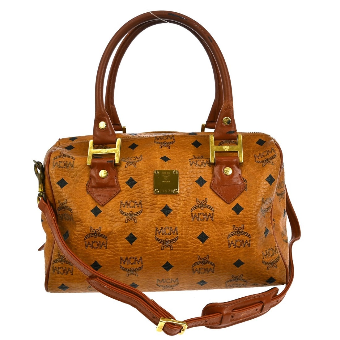 Visetos brown handbag by MCM for women: Visetos brown handbag by MCM for women This pre-owned MCM Visetos handbag comes in brown and is designed for female use. The bag shows signs of use, including scuffs and dirt on both the exterior and