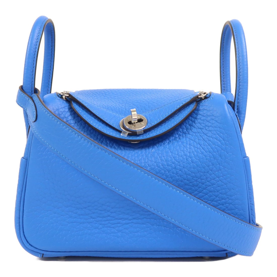Mini Lindy Blue Hydra Clemence Leather Shoulder Bag by Hermes: Mini Lindy Blue Hydra Clemence Leather Shoulder Bag by Hermes This Hermes Mini Lindy bag is crafted from Blue Hydra Clemence leather with a two-way shoulder and handbag design. Featuring premium calfs