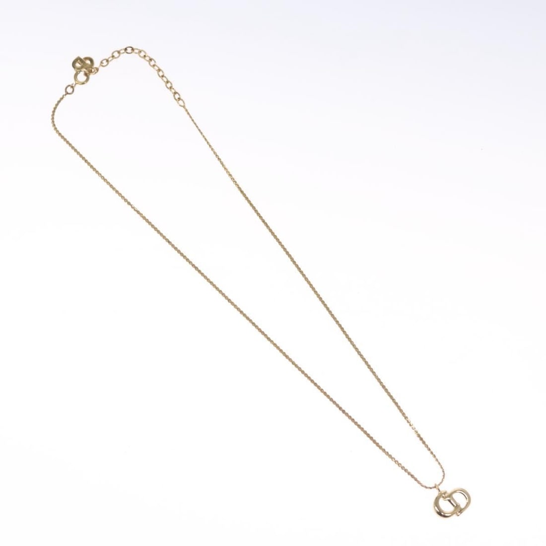 Gold Chain Necklace with CD Pendant by Christian Dior: Gold Chain Necklace with CD Pendant by Christian Dior This pre-owned Christian Dior pendant necklace features a gold-tone finish and is designed for women. It is in very clean condition with minor sur