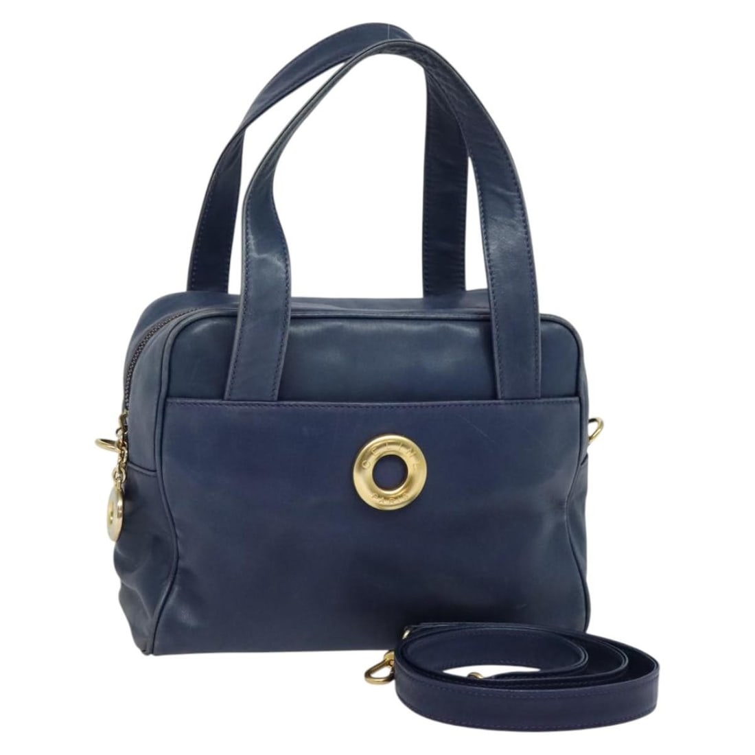 Blue Celine Handbag with Circle Logo Design: Blue Celine Handbag with Circle Logo Design This Celine Circle Logo handbag in blue is designed for women and features the iconic circular logo. The bag shows signs of use, including some deformation,