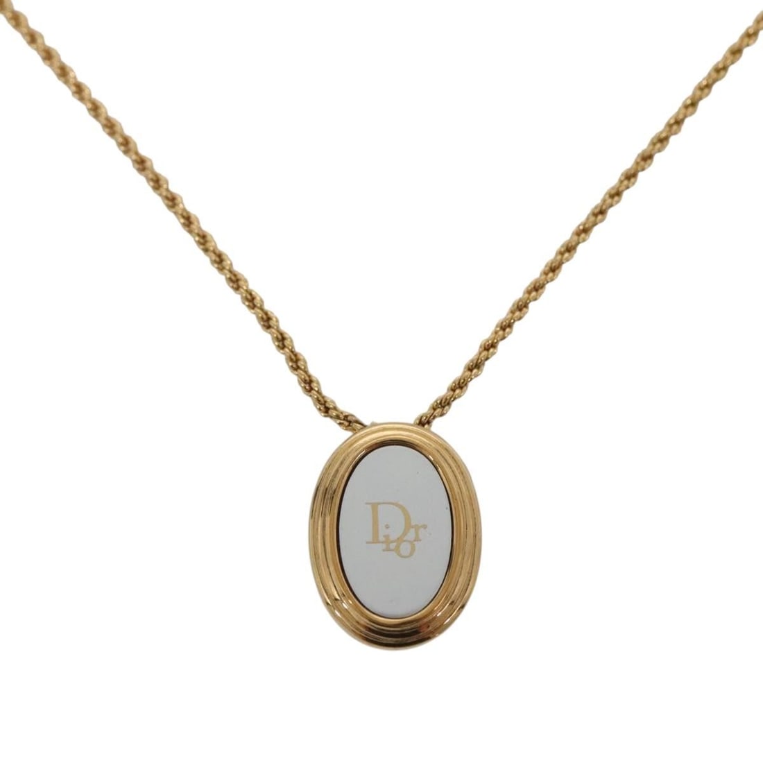 Vintage Dior Gold Tone Circular Logo Pendant Necklace: Vintage Dior Gold Tone Circular Logo Pendant Necklace This Christian Dior vintage round pendant necklace features the iconic logo design in a gold tone finish. The piece is designed for female wearers