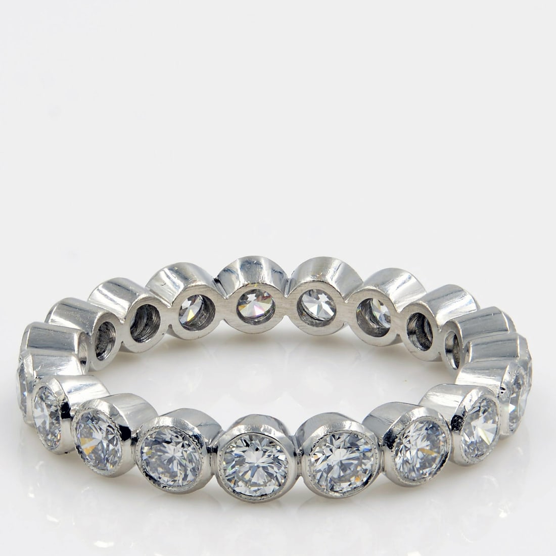 Rachel Koen Platinum Bezel Set Diamond Eternity Band 0.76ct 6.25: Rachel Koen Platinum Bezel Set Diamond Eternity Band 0.76ct 6.25 This exquisite Rachel Koen bezel set round diamond eternity band is crafted in premium platinum, featuring bright-white scintillating r
