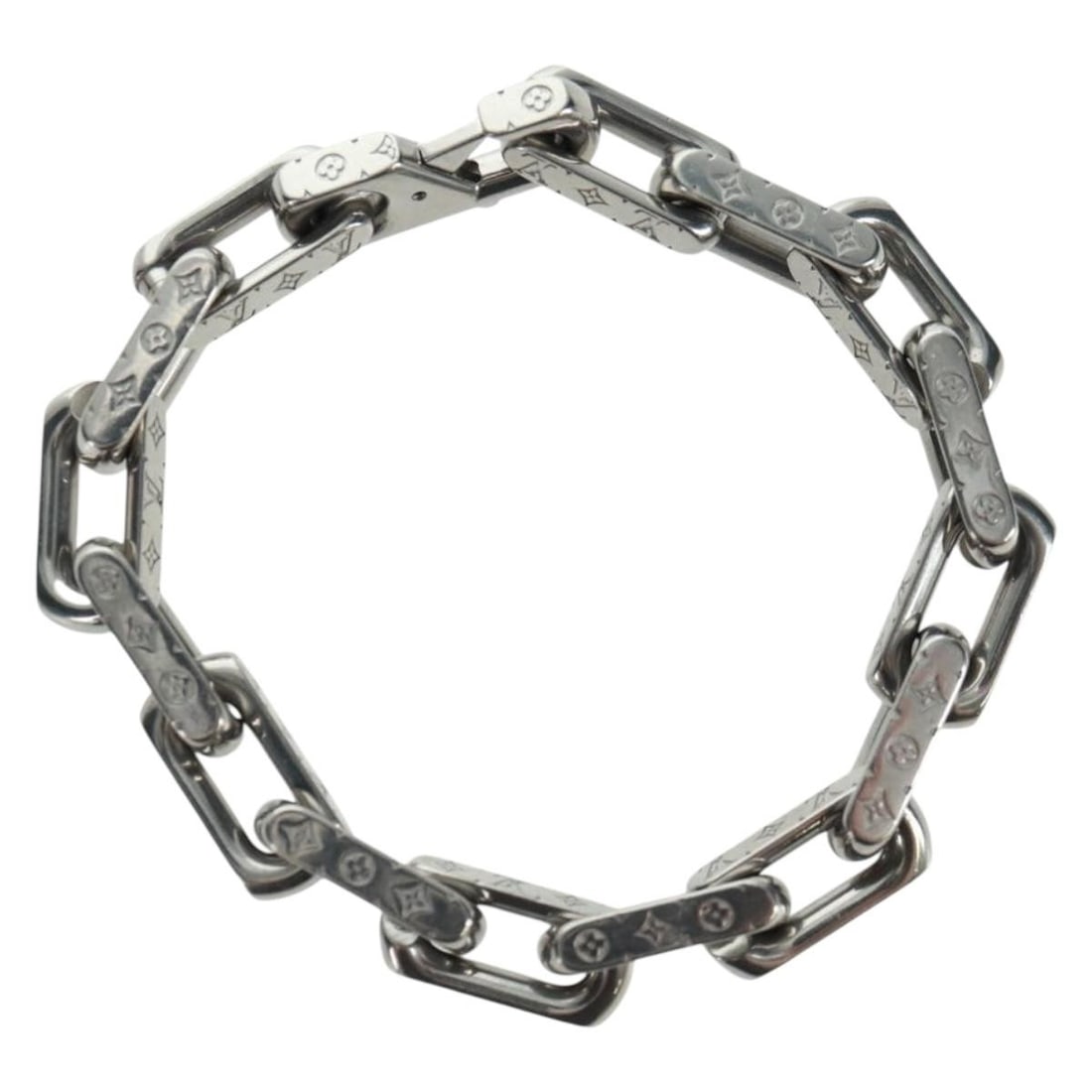 Monogram Canvas Silver Chain Bracelet by Louis Vuitton M00309: Monogram Canvas Silver Chain Bracelet by Louis Vuitton M00309 This Louis Vuitton Monogram Chain Bracelet features monogram canvas in monogram and silver tones. The bracelet is crafted in Italy and has