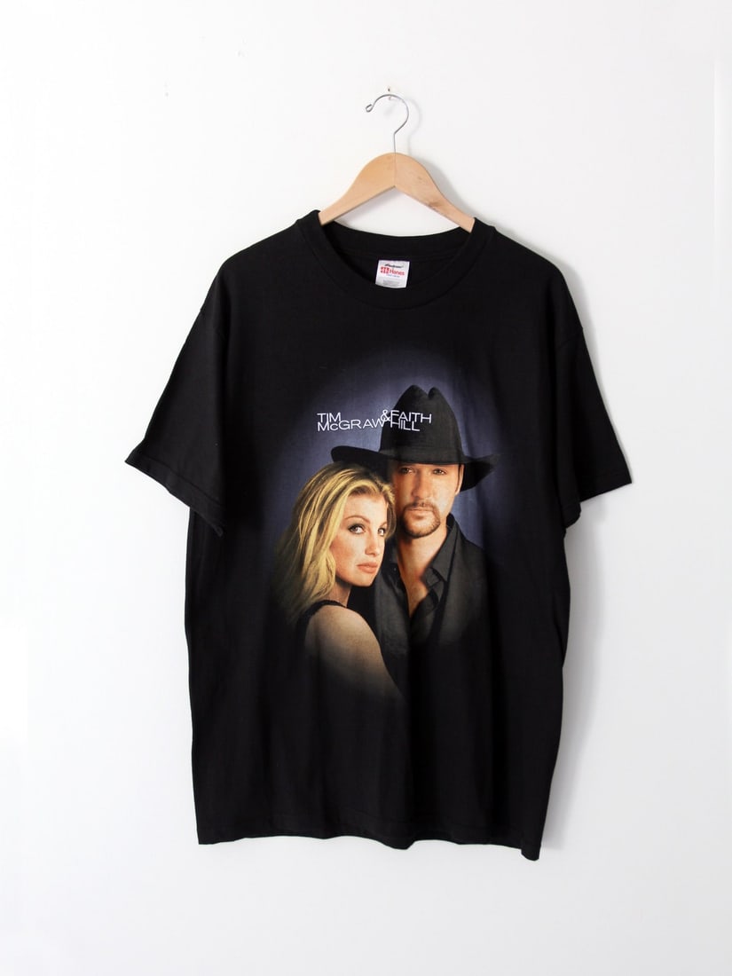 2000 Soul 2 Soul Tour Black Tee Featuring Tim McGraw and Faith Hill: 2000 Soul 2 Soul Tour Black Tee Featuring Tim McGraw and Faith Hill This vintage Tim McGraw & Faith Hill Soul 2 Soul Tour t-shirt from 2000 features a graphic of the duo on the front and a list of tou