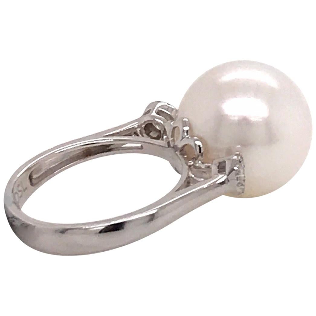 Harbor Diamonds 18K White Gold Three-Stone South Sea Pearl Diamond Ring: Harbor Diamonds 18K White Gold Three-Stone South Sea Pearl Diamond Ring This exquisite three-stone ring features a stunning South Sea Pearl centerpiece, measuring 14-15 MM, elegantly flanked by 26 rou