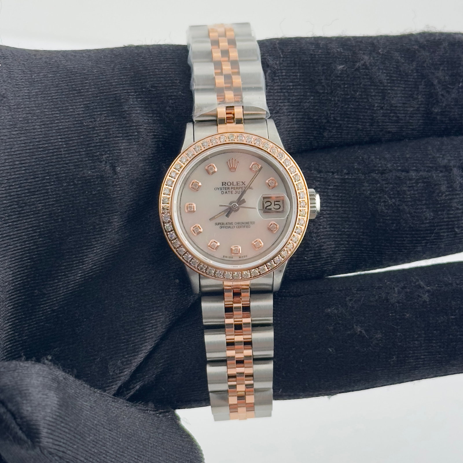 Rolex 6517 Ladies Datejust Aftermarket White MOP Diamond Dial Jubilee Watch: Rolex 6517 Ladies Datejust Aftermarket White MOP Diamond Dial Jubilee Watch This ladies Rolex Datejust features an aftermarket white mother of pearl diamond dial and a pave plated diamond bezel. The w