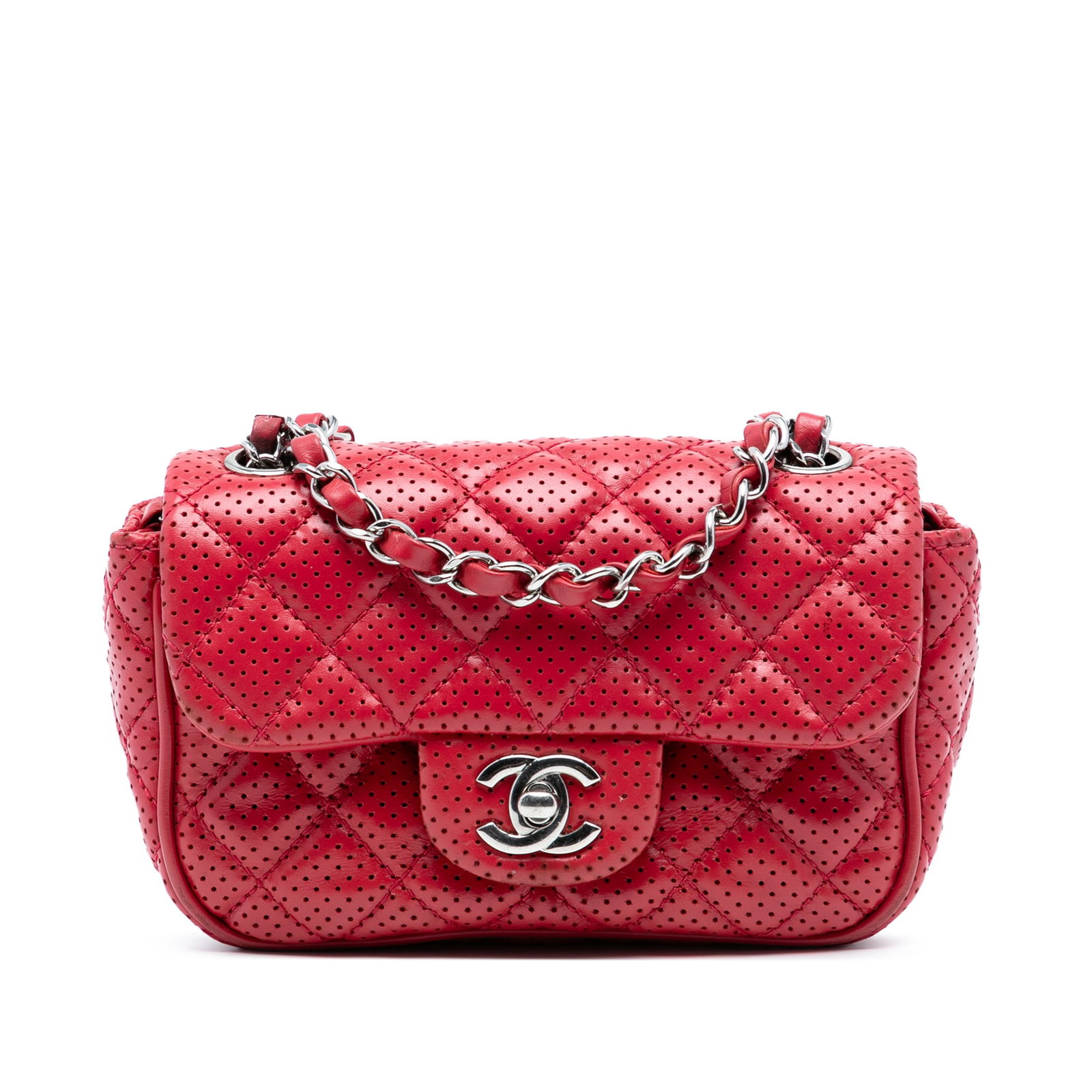 Chanel Mini Perforated Lambskin Flap Crossbody Bag Red: Chanel Mini Perforated Lambskin Flap Crossbody Bag Red This Chanel Mini Perforated Lambskin Punch Flap crossbody bag showcases an elegant design with a quilted perforated lambskin leather body. It fea