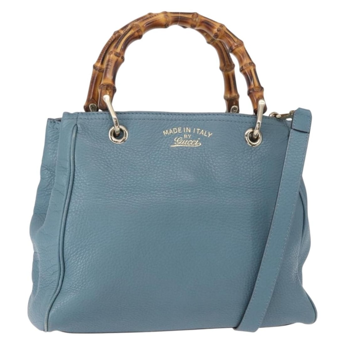 Blue Bamboo Shopper Tote Bag by Gucci: Blue Bamboo Shopper Tote Bag by Gucci This pre-owned Gucci Bamboo Shopper Tote in blue features leather construction with bamboo handles and a detachable shoulder strap. It is designed for female use