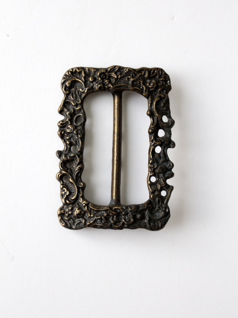 Vintage Brass Floral Art Nouveau Slide Buckle 3 inch: Vintage Brass Floral Art Nouveau Slide Buckle 3 inch Discover this exquisite vintage brass slide buckle featuring an elegant floral Art Nouveau design. Crafted with a stunning patina, this buckle show