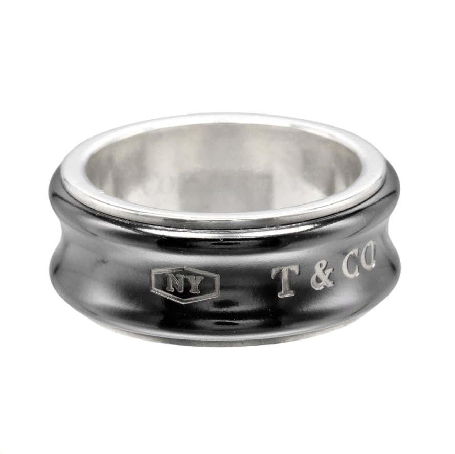 1837 Collection Silver Band Ring by Tiffany & Co.: 1837 Collection Silver Band Ring by Tiffany & Co. This pre-owned Tiffany & Co. 1837 band ring is crafted in silver. It features slight scratches consistent with gentle use, yet maintains its classic a