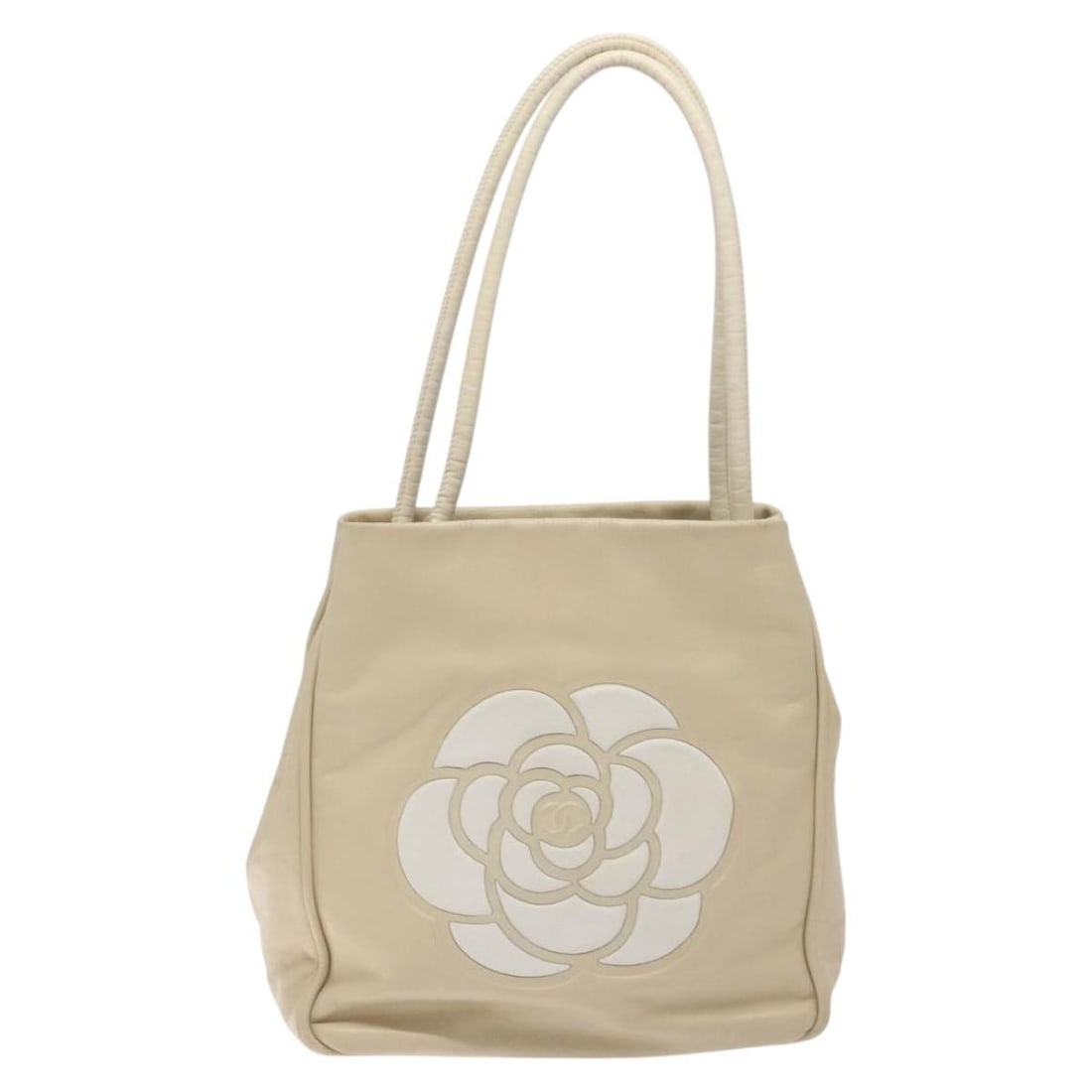 Ivory Camellia Tote Bag by Chanel: Ivory Camellia Tote Bag by Chanel This Chanel Camellia Tote in ivory is designed for women and features a spacious interior with multiple pockets. The bag shows signs of use, including loss of shape,