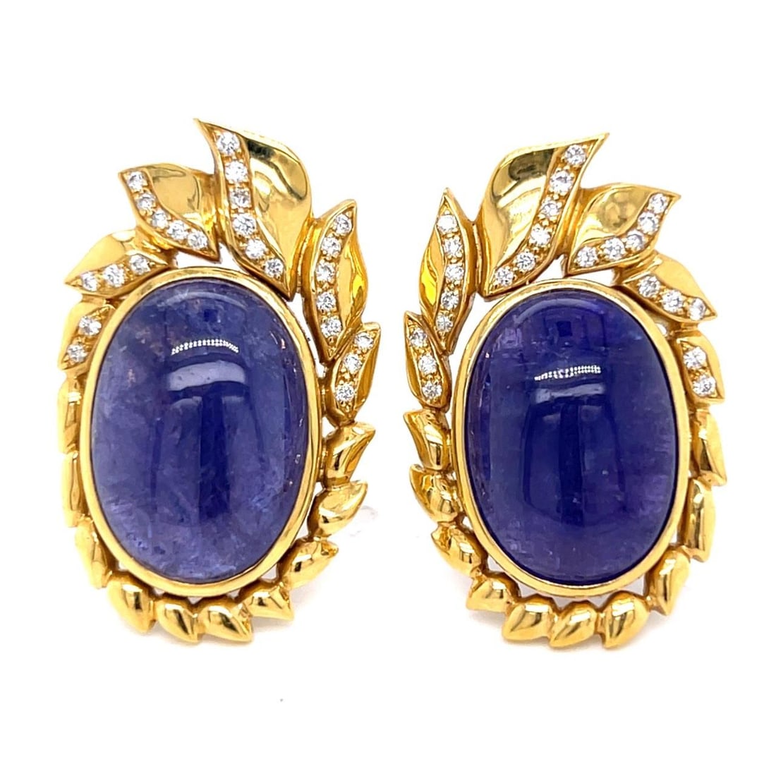 KAUFMAN DE SUISSE 18K Gold Tanzanite Diamond Earrings 30 Ct: KAUFMAN DE SUISSE 18K Gold Tanzanite Diamond Earrings 30 Ct These exquisite KAUFMAN DE SUISSE earrings are crafted in 18K yellow gold and feature stunning tanzanites and diamonds. They weigh 27.2 gram
