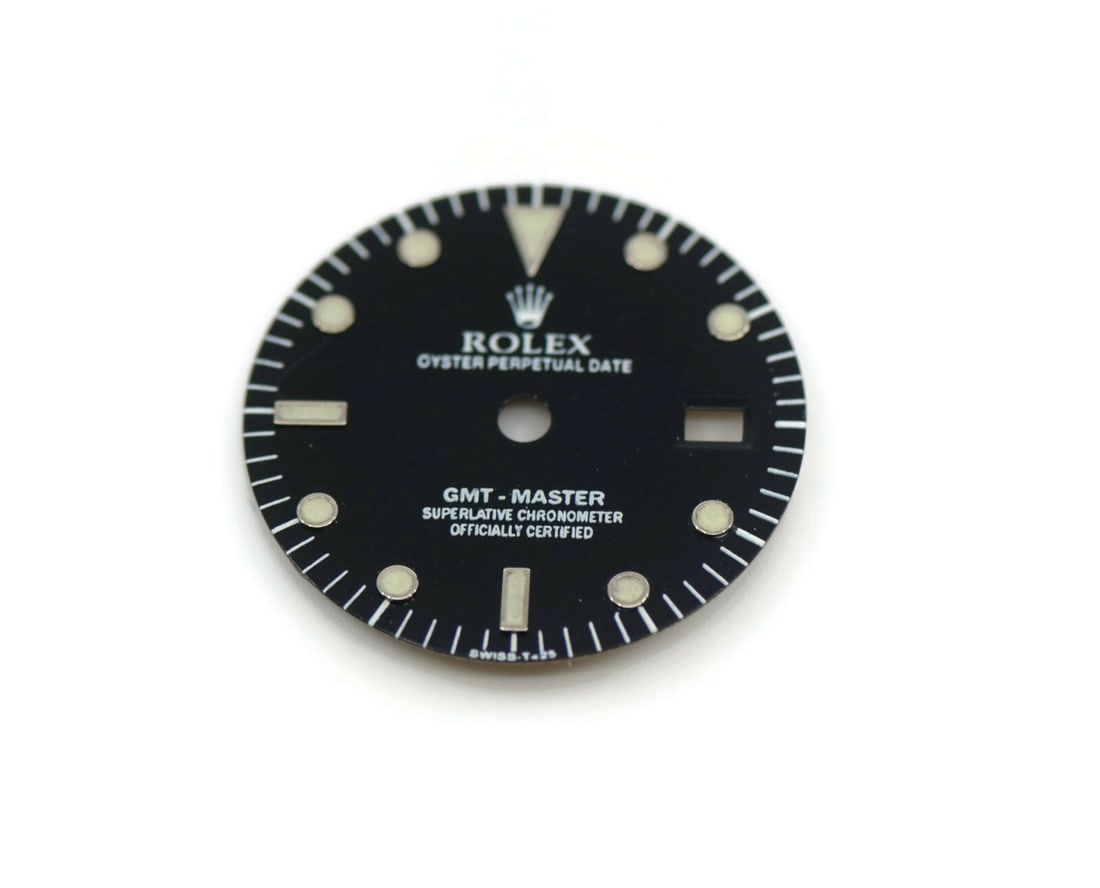 Rolex GMT-Master 27.2mm Glossy Dial 100% Authentic: Rolex GMT-Master 27.2mm Glossy Dial 100% Authentic This is a genuine Rolex GMT-Master glossy dial, a crucial component for collectors and watch enthusiasts looking to restore or enhance their timepiec
