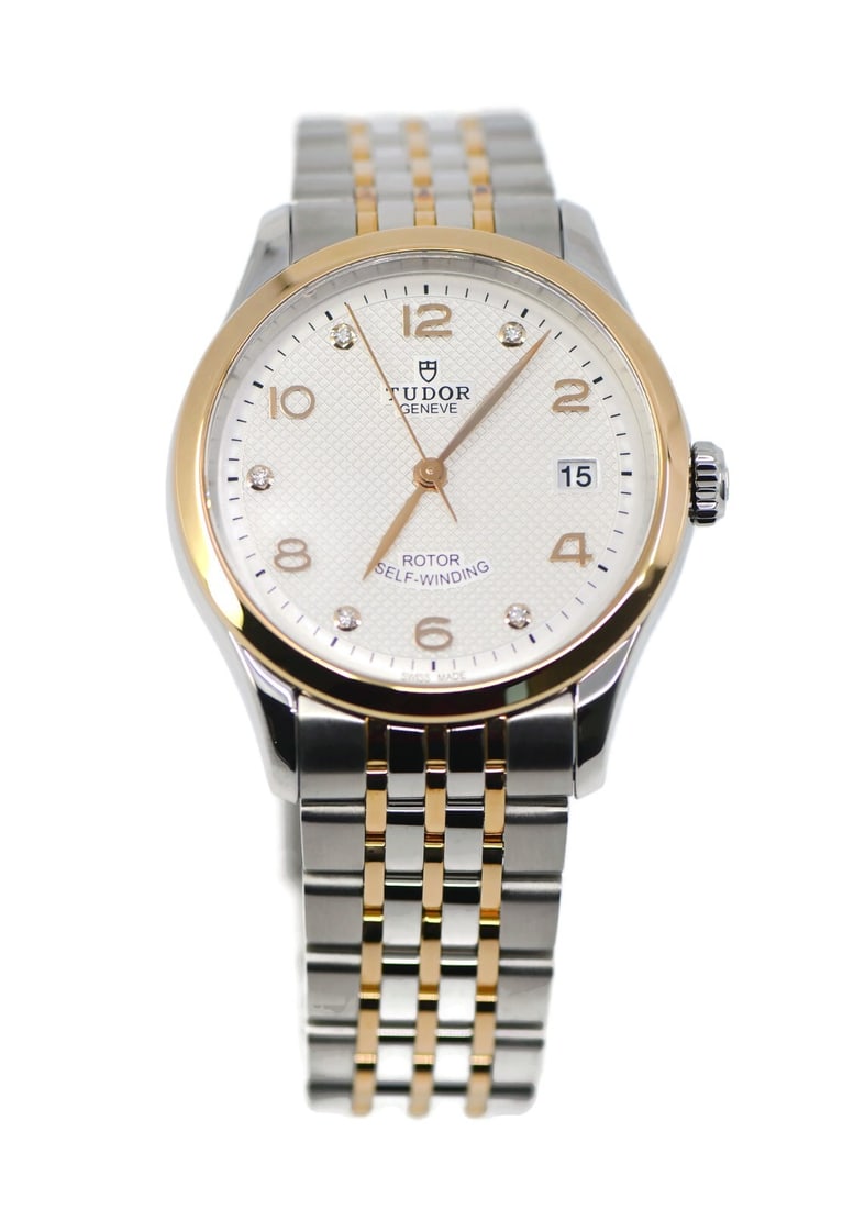 TUDOR 1926 Diamond Automatic 18K Steel Watch 91451 with Box and Papers: TUDOR 1926 Diamond Automatic 18K Steel Watch 91451 with Box and Papers This exquisite Tudor 1926 Diamond wristwatch combines luxury and precision with its mechanical (automatic) movement. Crafted from