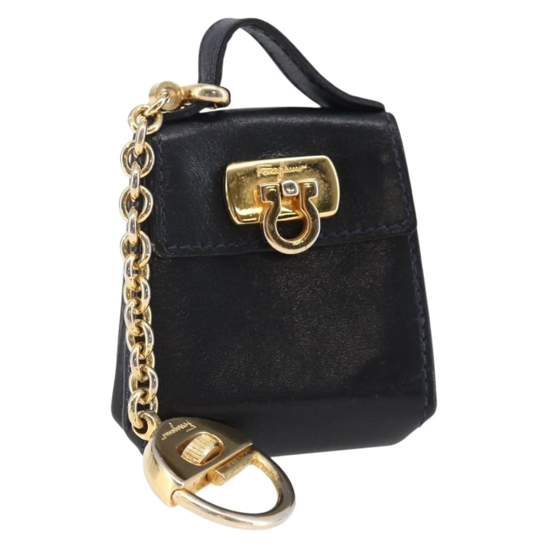 Salvatore Ferragamo Gancini Leather Charm Navy Gold Made in Italy: Salvatore Ferragamo Gancini Leather Charm Navy Gold Made in Italy This exquisite Salvatore Ferragamo Gancini Charm is crafted from high-quality leather in a sophisticated navy and gold color combinati