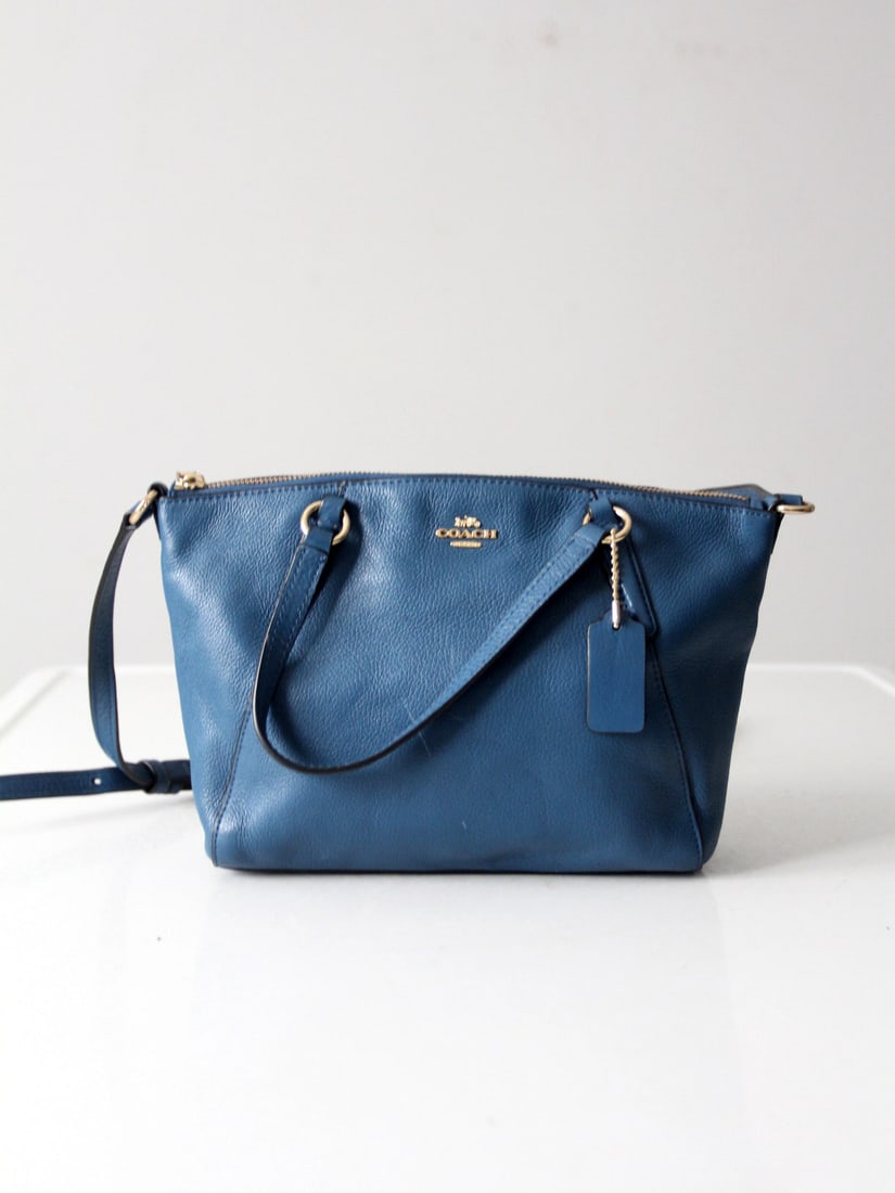 Coach Kelsey Satchel Crossbody Bag Soft Leather Blue: Coach Kelsey Satchel Crossbody Bag Soft Leather Blue Elevate your everyday style with this Coach Small Kelsey Satchel crafted from soft pebbled leather in a muted blue hue, complemented by gold-tone h