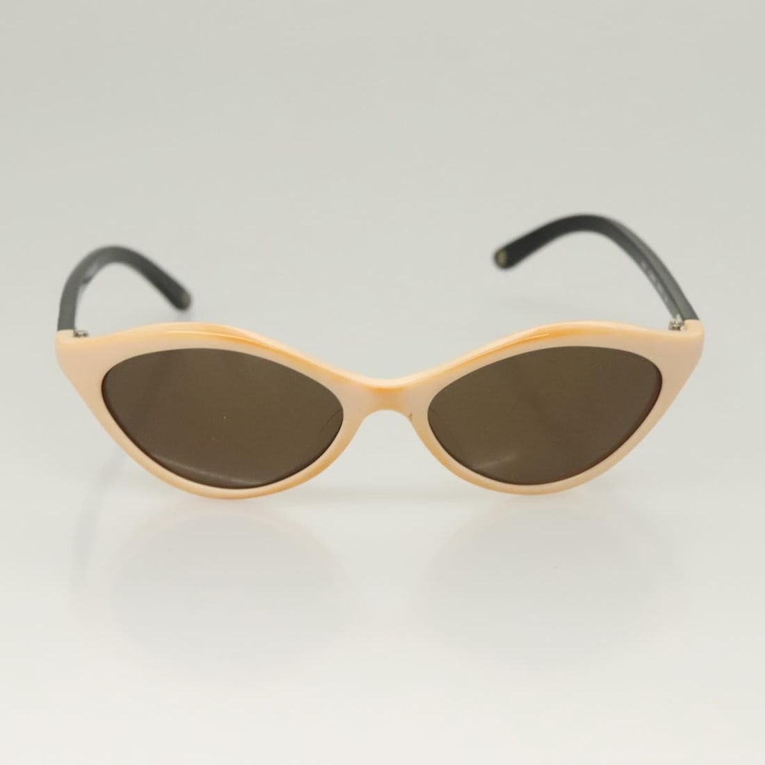 Beige Sunglasses with Logo Detail by Chanel: Beige Sunglasses with Logo Detail by Chanel Chanel sunglasses featuring a beige frame and signature logo detailing. Designed for women, these sunglasses are in good condition with minor rubbing on the