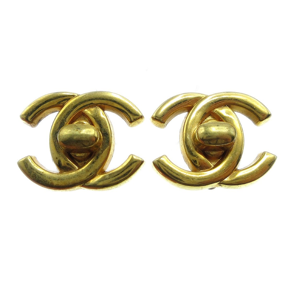 CC Turnlock Gold Clip-On Earrings by Chanel: CC Turnlock Gold Clip-On Earrings by Chanel These Chanel CC Turnlock clip-on earrings are designed for women and feature the iconic CC logo. The earrings are in fair condition with some signs of damag