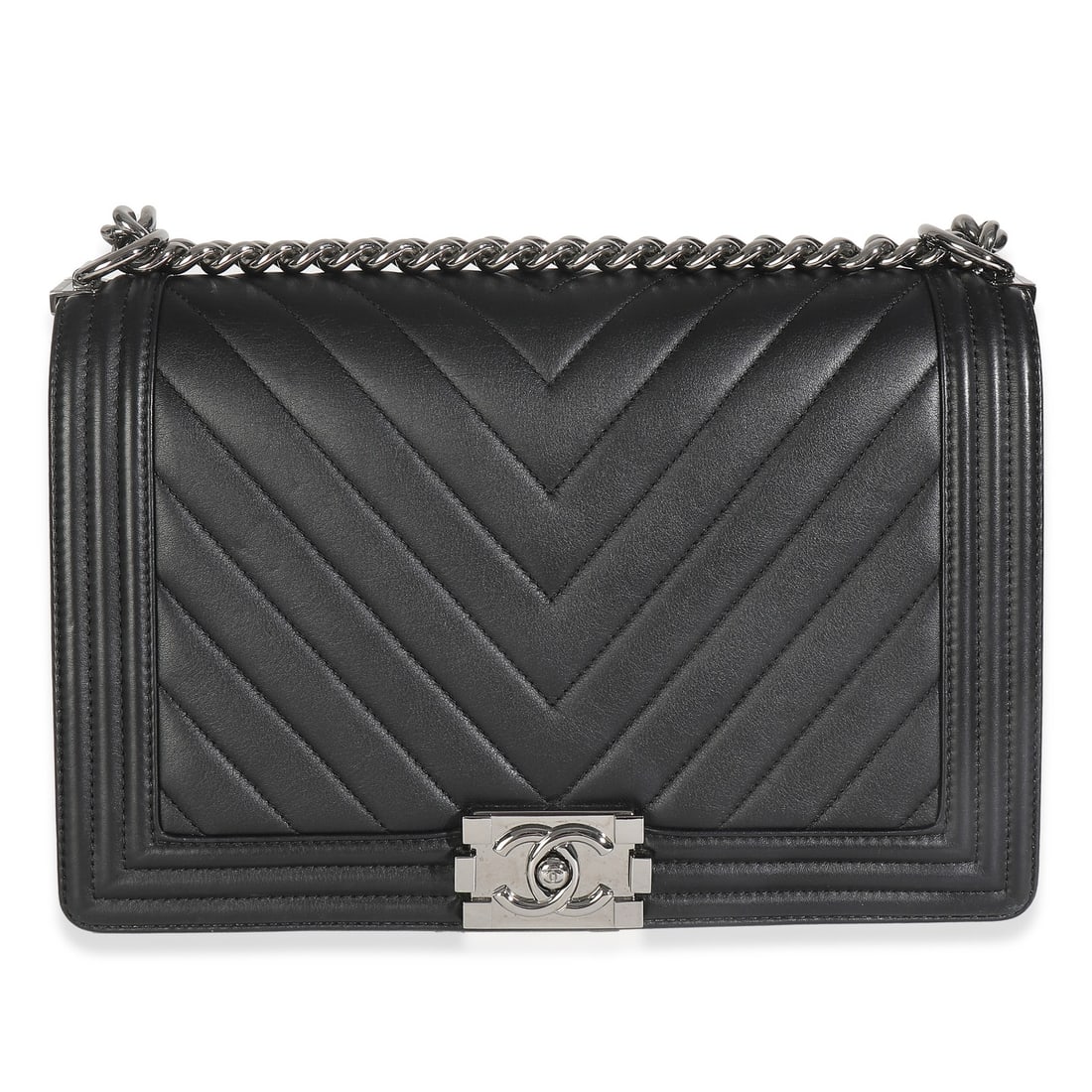 Black Chevron Quilted Leather Chanel New Medium Boy Shoulder Bag with Dustbag: Black Chevron Quilted Leather Chanel New Medium Boy Shoulder Bag with Dustbag This Chanel New Medium Boy Bag is crafted from black calfskin leather in a quilted chevron pattern. Featuring silver-tone