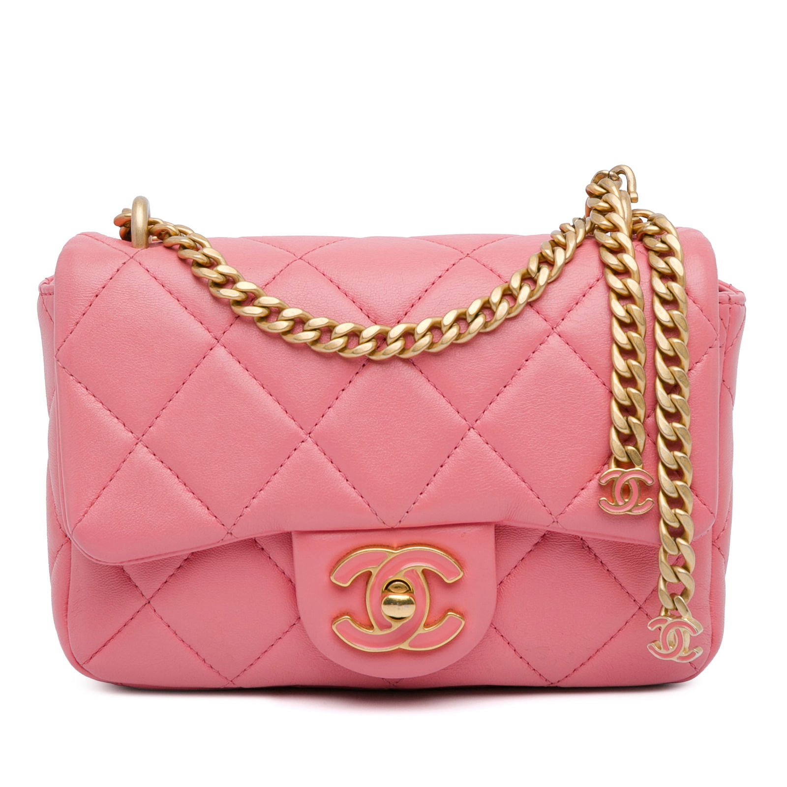 Chanel Mini Lambskin Pending CC Flap Pink Crossbody Bag: Chanel Mini Lambskin Pending CC Flap Pink Crossbody Bag This exquisite Chanel Mini Lambskin Pending CC Flap crossbody bag is crafted from luxurious quilted lambskin leather in a charming pink hue. It