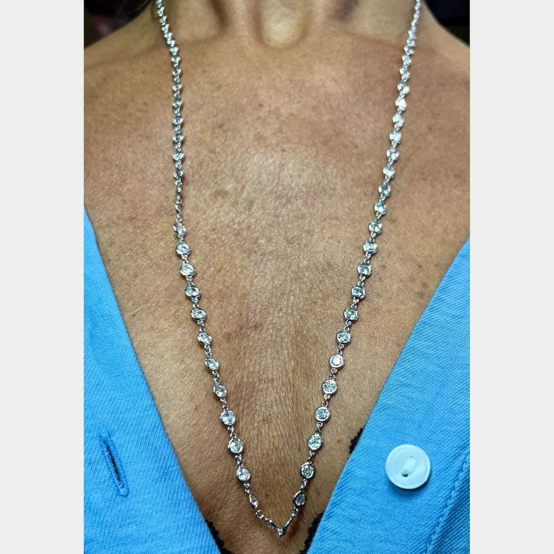 18K White Gold 12.40 Ct Diamond by the Yard Necklace 27": 18K White Gold 12.40 Ct Diamond by the Yard Necklace 27" This stunning 18K White Gold Necklace features a dazzling display of 84 diamonds, totaling approximately 12.40 carats. The diamonds are graded