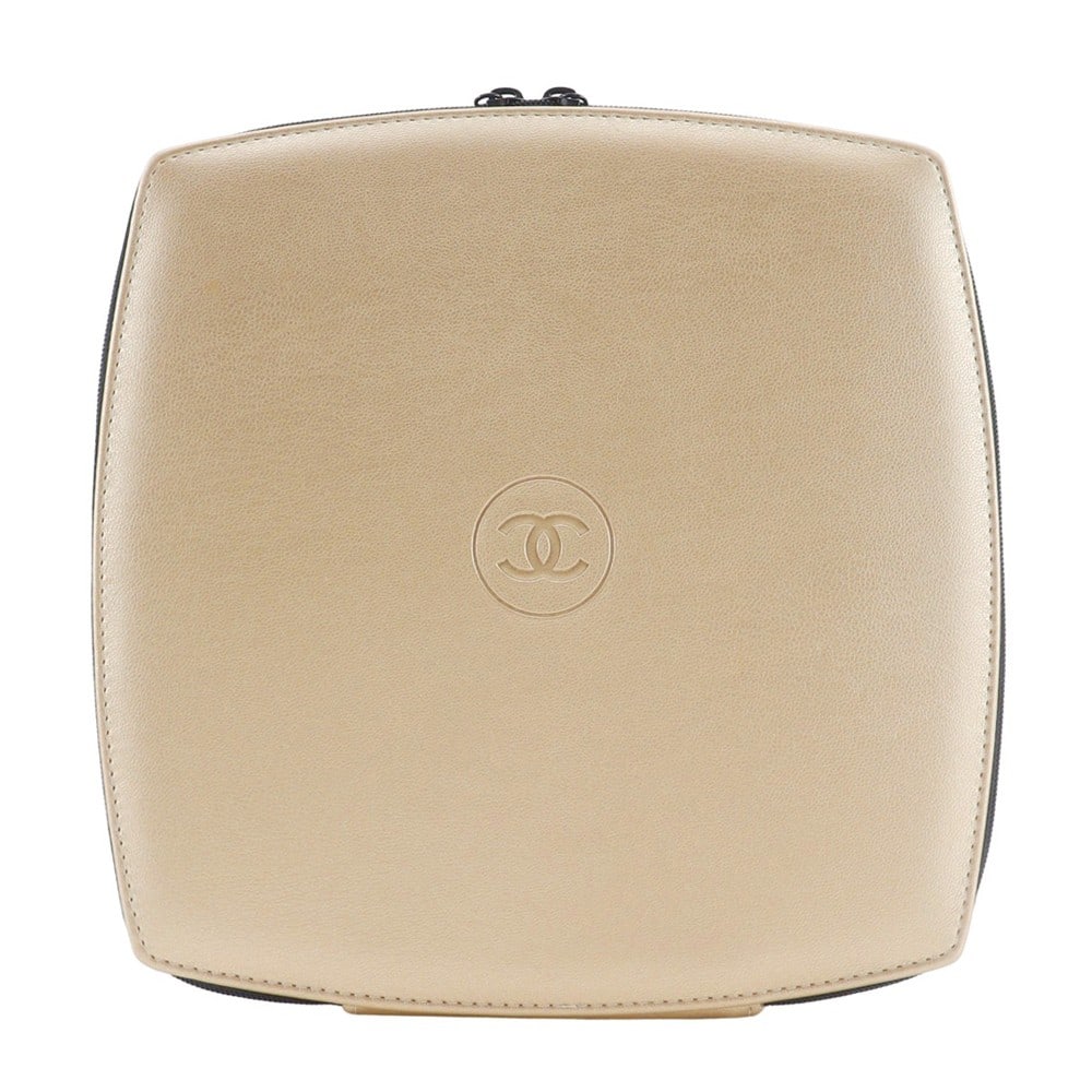 Sabri Mage Gold Pouch by Chanel: Sabri Mage Gold Pouch by Chanel This Chanel Sabri Mage pouch is a stylish clutch designed for women. It features a gold-tone exterior with minor stains and a clean interior, also showing minor stains