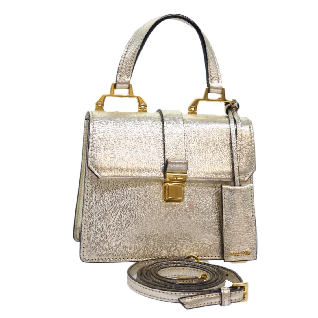 Madras Convertible Leather Handbag with Compartments by Miu Miu: Madras Convertible Leather Handbag with Compartments by Miu Miu This Miu Miu Madras Convertible Compartment Top Handle Bag features a classic top handle design and compartmentalized storage. The exter