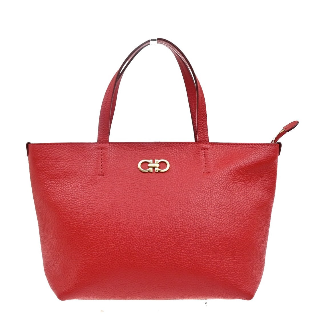 Gancini Red Tote Bag by Salvatore Ferragamo: Gancini Red Tote Bag by Salvatore Ferragamo This Salvatore Ferragamo Gancini tote is designed for women and features a striking red exterior. The tote bag shows signs of previous use, including scuffs