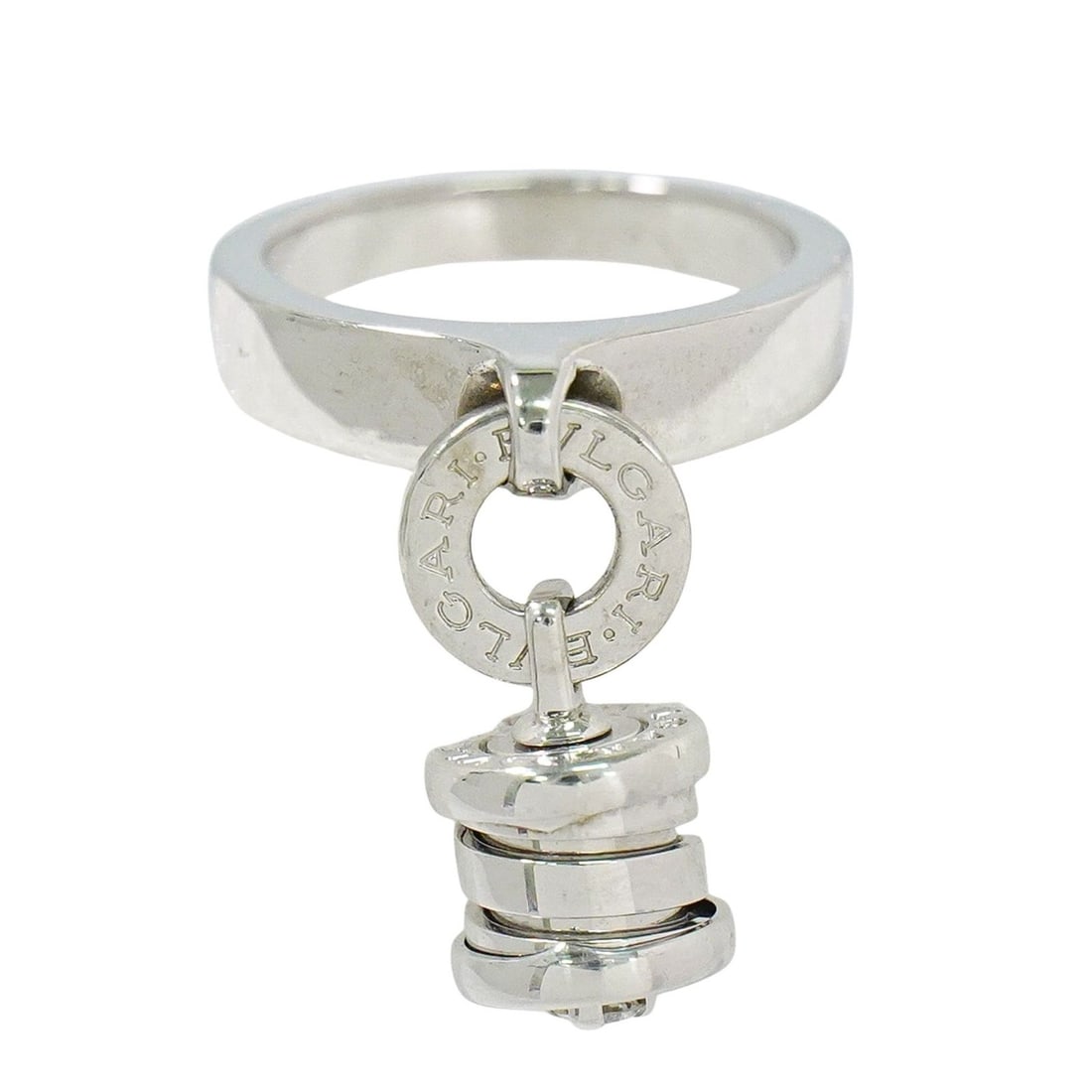 B.Zero1 Element Dangle Charm Ring in White by Bvlgari: B.Zero1 Element Dangle Charm Ring in White by Bvlgari This pre-owned Bvlgari B.Zero1 Element Dangle Charm ring is designed for women and remains in very good condition, displaying only minor scratches
