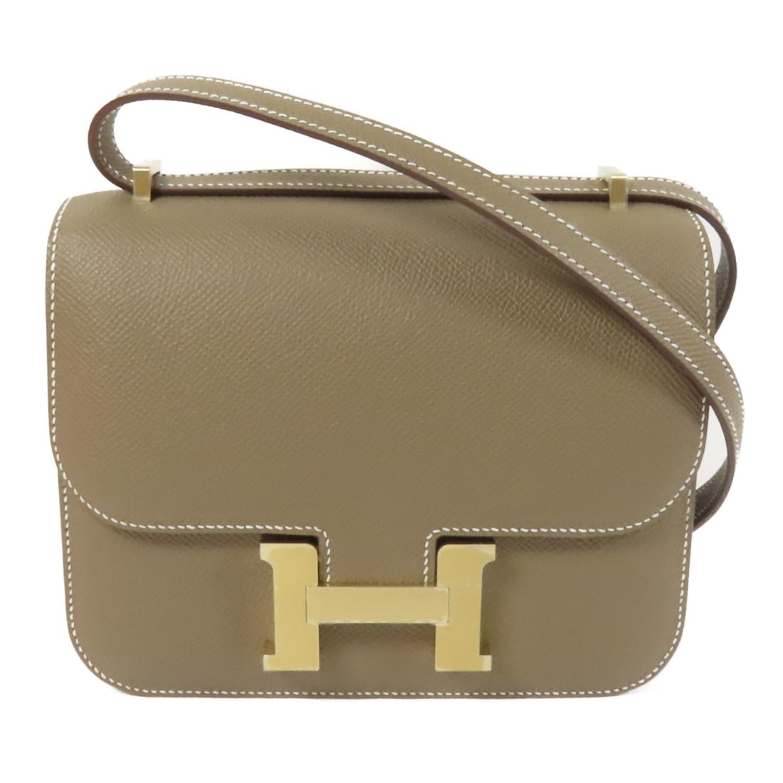 HERMES Constance Mini Shoulder Bag Epsom Leather Gray GHW: HERMES Constance Mini Shoulder Bag Epsom Leather Gray GHW This exquisite HERMES Constance Mini Shoulder Bag is crafted from high-quality Epsom leather, featuring a stunning gray calfskin exterior. Its