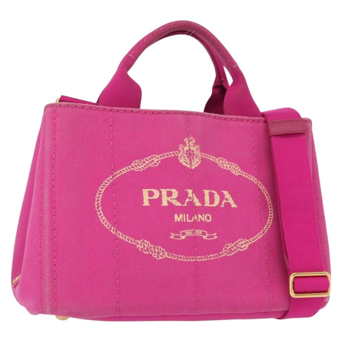 Pink Canapa PM Shoulder Bag by Prada: Pink Canapa PM Shoulder Bag by Prada This pre-owned Prada Canapa PM shoulder bag features a pink canvas exterior. The bag shows signs of use, including rubbing and slight stains on the surface, handle