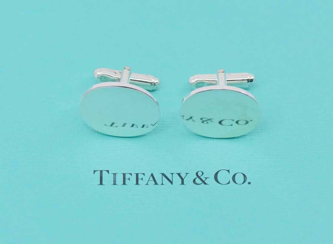 Tiffany & Co Sterling Silver Cufflinks 22x16mm 100% Authentic: Tiffany & Co Sterling Silver Cufflinks 22x16mm 100% Authentic Elevate your formal attire with these exquisite Tiffany & Co. Sterling Silver cufflinks. Crafted from high-quality sterling silver, these