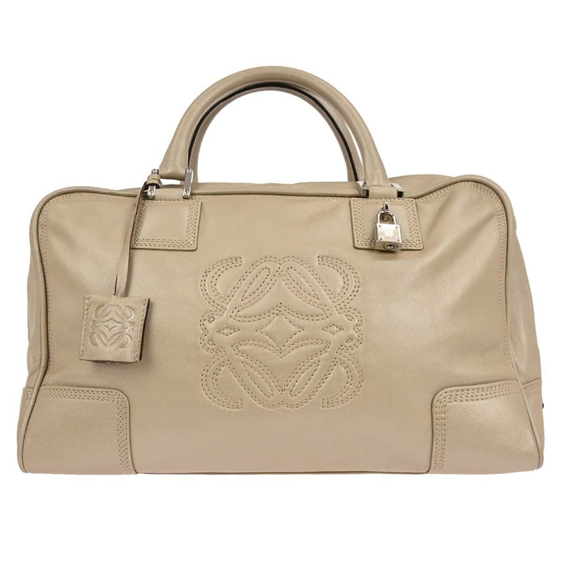 Amazona 36 Large White Leather Top Handle Bag by Loewe: Amazona 36 Large White Leather Top Handle Bag by Loewe This Loewe Amazona 36 handbag features a white leather exterior with double leather handles and a zip closure. Designed in a large size, it offer