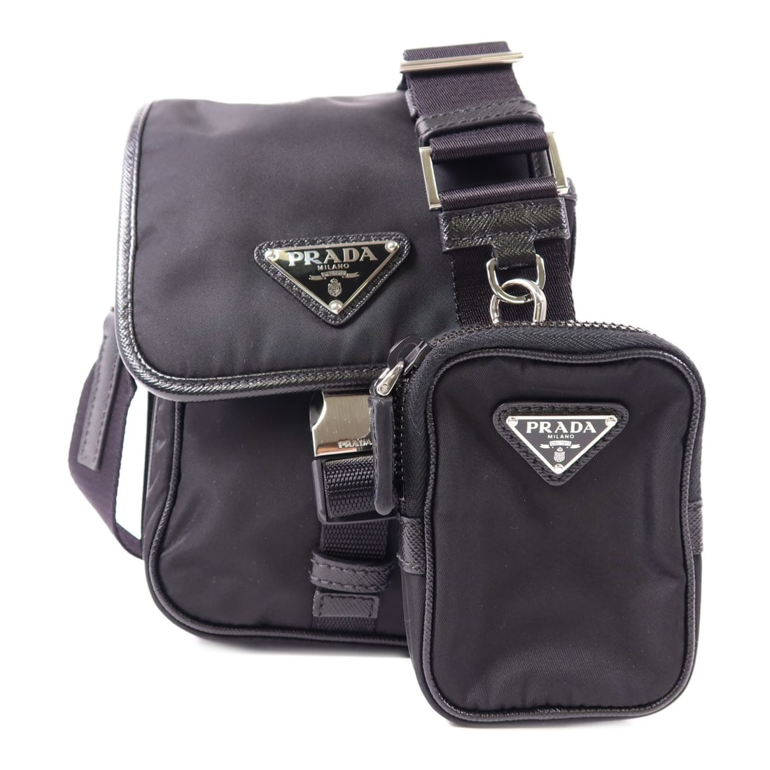 PRADA Black Nylon Shoulder Bag Stylish and Compact: PRADA Black Nylon Shoulder Bag Stylish and Compact This PRADA shoulder bag is a stylish accessory crafted from high-quality nylon in a classic black color. With dimensions of 7.7 in height, 5.3 in len