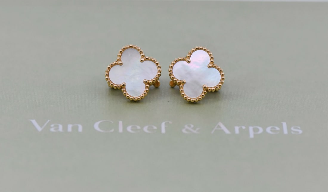 Van Cleef & Arpels Vintage Alhambra 18K Yellow Gold Stud Earrings with Mother of Pearl: Van Cleef & Arpels Vintage Alhambra 18K Yellow Gold Stud Earrings with Mother of Pearl Discover the elegance of these Van Cleef & Arpels Vintage Alhambra earrings, crafted from luxurious 18K yellow go