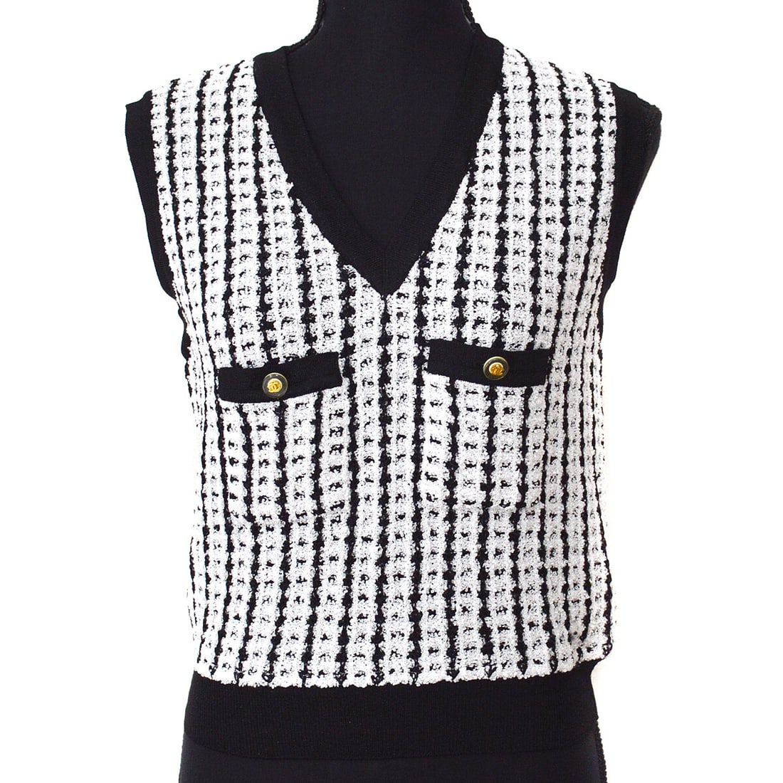Vintage Chanel 97P Black White Check Sleeveless Vest Top Sweater #42: Vintage Chanel 97P Black White Check Sleeveless Vest Top Sweater #42 This elegant Chanel sleeveless vest top sweater features a classic check pattern in a timeless black and white color scheme. Design