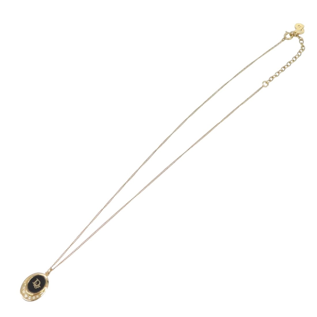 Vintage Round Pendant Necklace with Logo by Christian Dior: Vintage Round Pendant Necklace with Logo by Christian Dior This vintage Christian Dior necklace features a round logo pendant with a gold finish. Designed for women, it offers classic elegance and tim